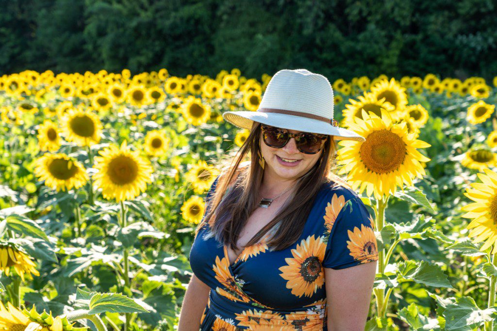 Amanda in a sunflower field