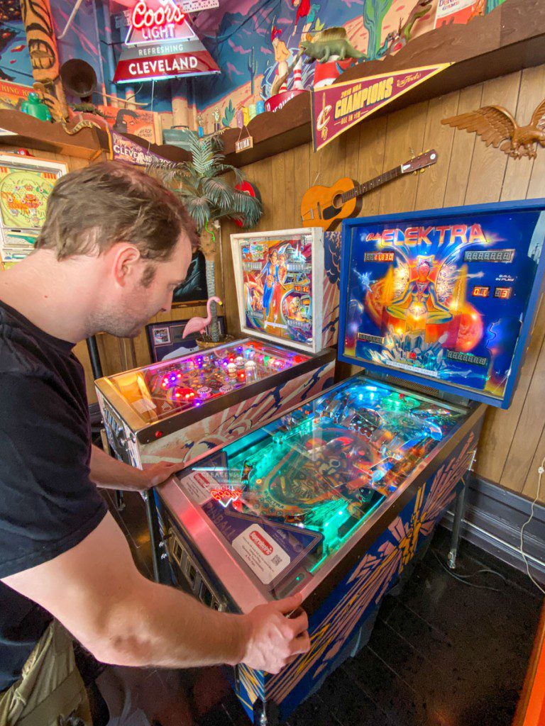 Elliot playing a game at Superelectric Pinball Parlor