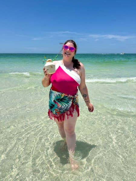 Amanda with a coconut on the beach